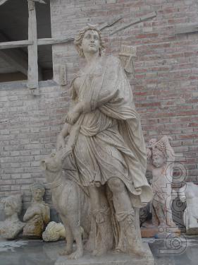 Park sculpture of Diana the huntress . Mat