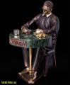 bronze sculpture of a football player, a bronze statuette poker star 