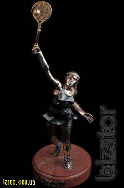bronze sculpture of a football player, a bronze statuette poker star 