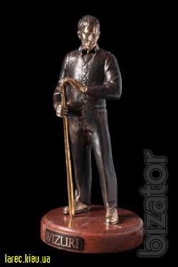 bronze sculpture of a football player, a bronze statuette poker star 