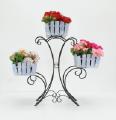 Country wrought iron stand with wooden planters for flowers.