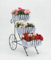 Country wrought iron stand with wooden planters for flowers. 