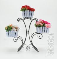 Country wrought iron stand with wooden planters for flowers. 