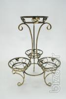 Country wrought iron stand with wooden planters for flowers. 