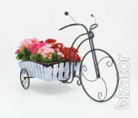 Country wrought iron stand with wooden planters for flowers. 