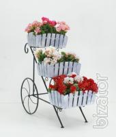 Country wrought iron stand with wooden planters for flowers. 