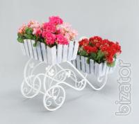 Country wrought iron stand with wooden planters for flowers. 