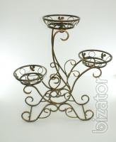 Country wrought iron stand with wooden planters for flowers. 