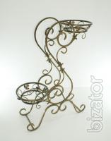 Country wrought iron stand with wooden planters for flowers. 