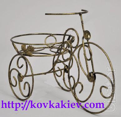Wrought iron stand for flowers Bikes. 