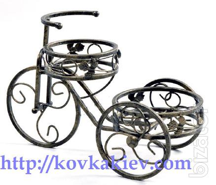 Wrought iron stand for flowers Bikes. 