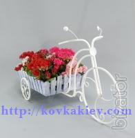 Wrought iron stand for flowers Bikes. 