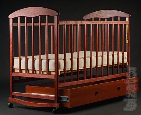 Cot "Natalka" in a dark tone with drawer. 