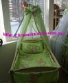 A set of clothes in the crib with canopy and protection A set of clothes in the crib with canopy and protection