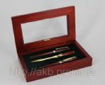 A set of writing instruments: pen, pen, knife