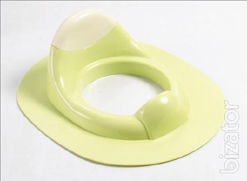 A child seat on the toilet 
