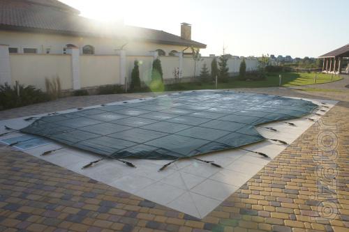 The cover for composite pool "Water World". Protective covering on a fiberglass pool. 