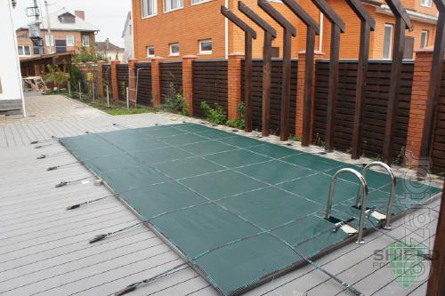 The cover for the pool Compass Pool. Protective covering for the pool. 