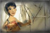 The doll in the photo.Portrait of textile cook