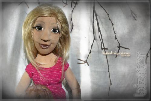 The doll in the photo.Portrait of textile cook