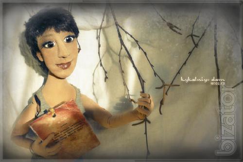 The doll in the photo.Portrait of textile cook