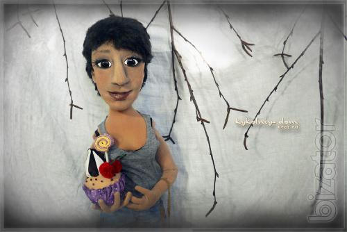 The doll in the photo.Portrait of textile cook