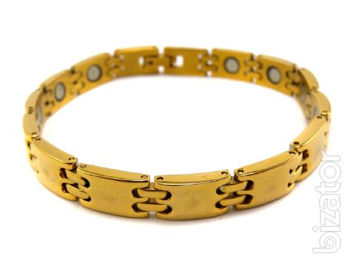 The magnetic bracelets from stainless steel or titanium with a coating of gold 