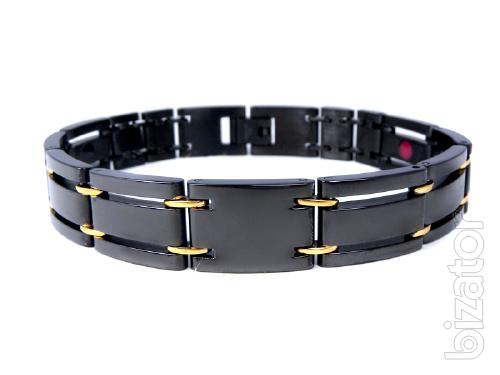 The magnetic bracelets from stainless steel or titanium with a coating of gold 