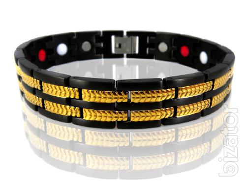 The magnetic bracelets from stainless steel or titanium with a coating of gold 
