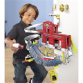 Playing a set of "Vertical fire station" Matchbox.Manufacturer Mattel. 