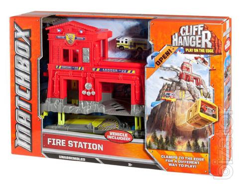 Playing a set of "Vertical fire station" Matchbox.Manufacturer Mattel. 