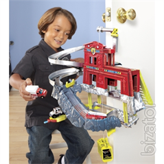 Playing a set of "Vertical fire station" Matchbox.Manufacturer Mattel. 