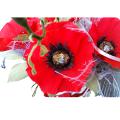 Candy bouquet of Poppies in a white basket 