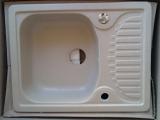 Kitchen sinks made of artificial stone in your home