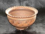 A clay bowl is handmade. "Dairy ceramics"