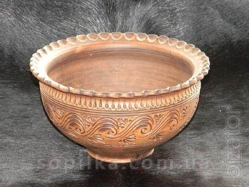 A clay bowl is handmade. "Dairy ceramics" 