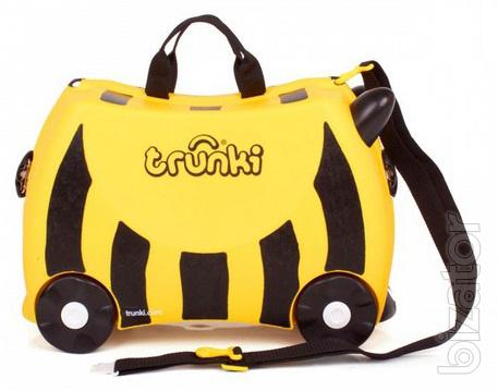 Baby briefcase British firm Trunki on wheels. Action 
