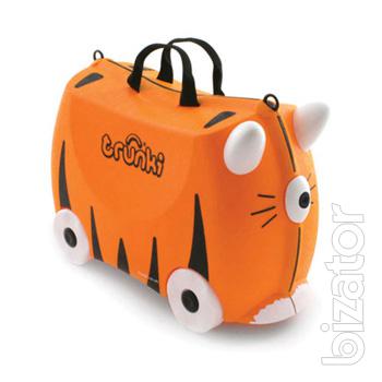 Baby briefcase British firm Trunki on wheels. Action 