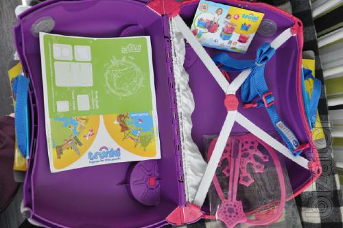 Baby briefcase British firm Trunki on wheels. Action 
