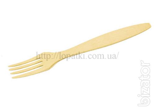 Wooden kitchen blades, forks, cutting boards, spoons. A logo 