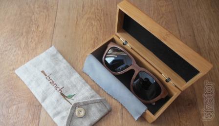 Glasses in a wooden frame is a stylish and exclusive accessory 