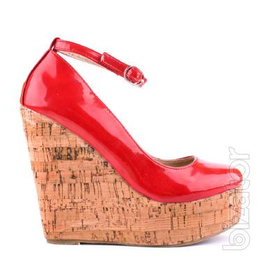 Red patent shoes with high wedge heels 