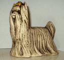 Dog statuettes from porcelain, faience, majolica 