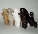 Dog statuettes from porcelain, faience, majolica, 