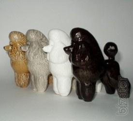 Dog statuettes from porcelain, faience, majolica, 